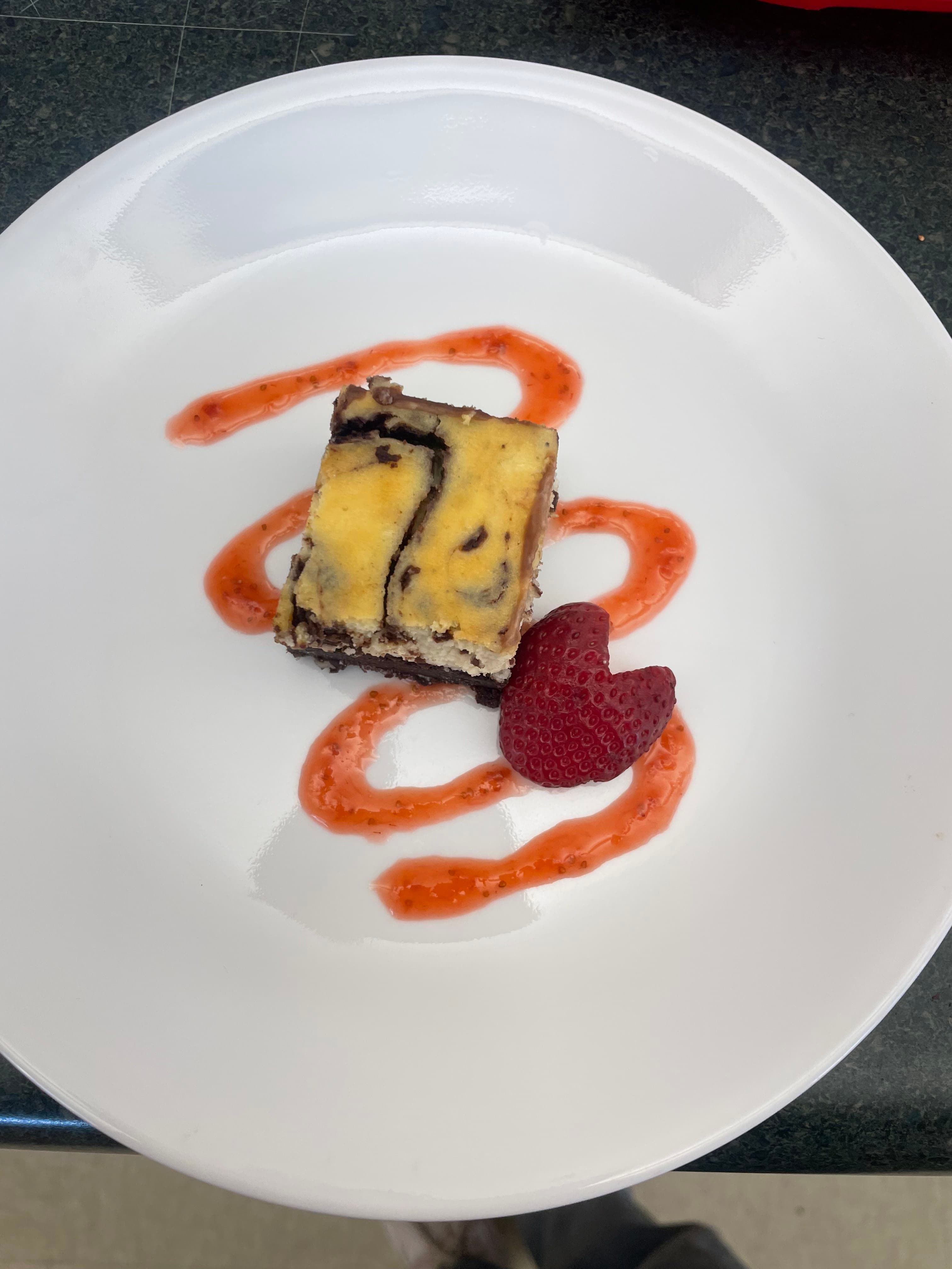 Plated dessert with strawberry sauce
